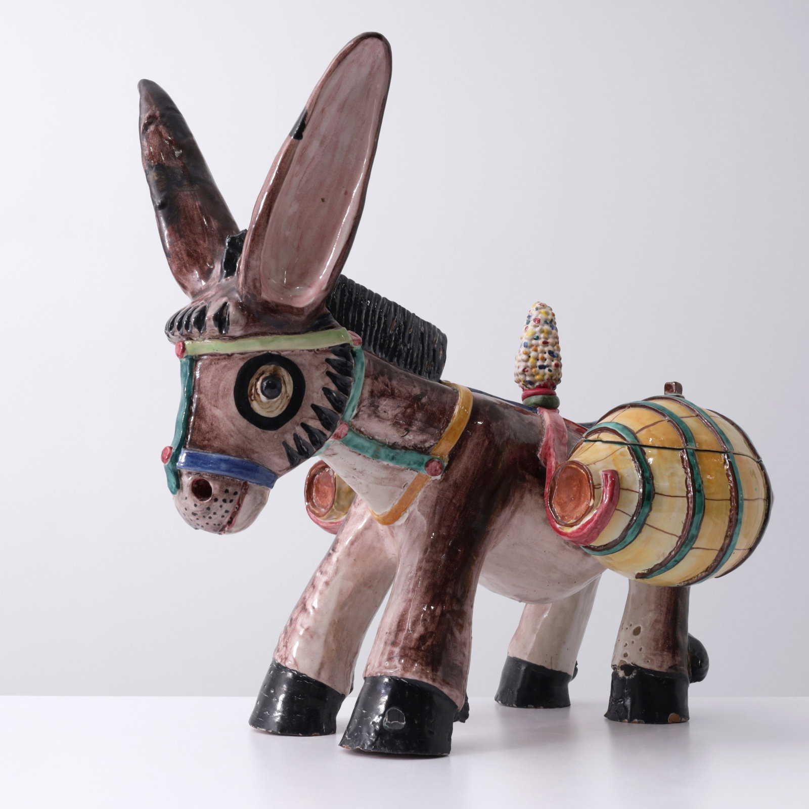 Industria Ceramica Salernitana Donkey Sculpture, 24"W: Artist/Designer/Manufacturer: Industria Ceramica Salernitana (Italy) Marking(s); notes: marking(s) Materials: hand painted ceramic Dimensions (H, W, D): 