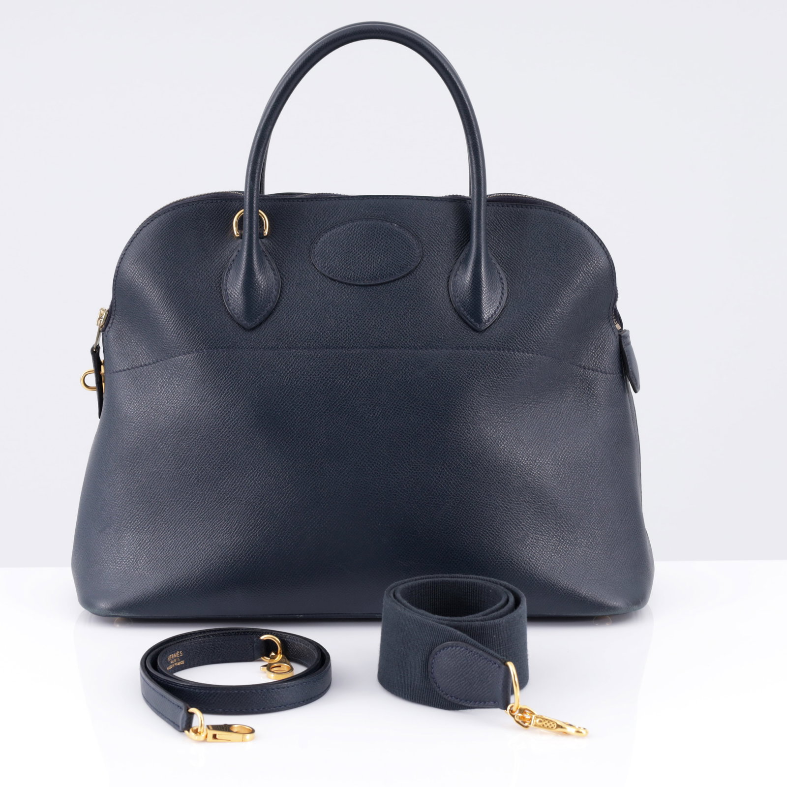 Hermes BOLIDE 35 Dark Blue Leather Handbag: Artist/Designer/Manufacturer: Hermes (France) Marking(s); notes: Hermes imprints, blind stamp, (X), marking(s); 1994 Materials: textured leather, gold-tone metal hardware
