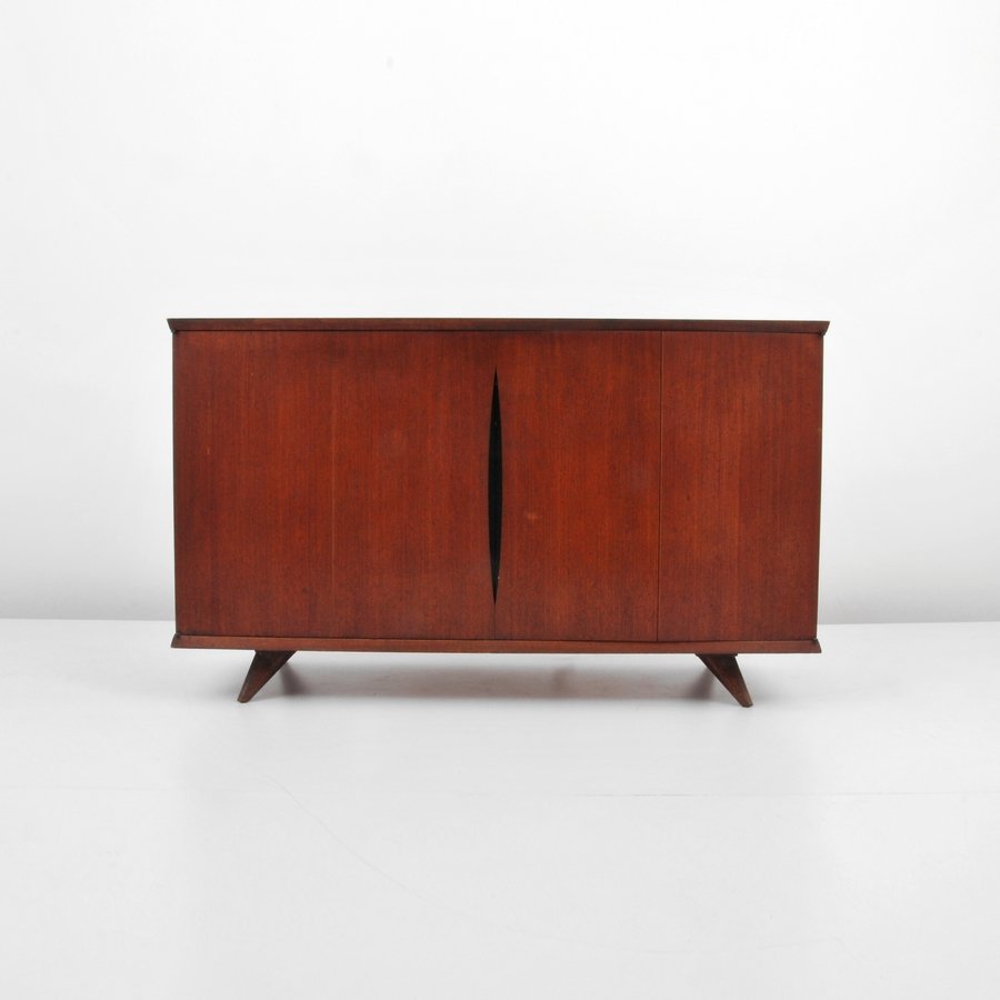 Vladimir Kagan Cabinet Stereo Cabinet: Designer & Manufacturer: Vladimir Kagan; Kagan-Dreyfuss Inc. Markings: none Country of Origin & Materials: USA; wood, other Additional Information & Circa: Cabinet with two doors revealing stereo equi