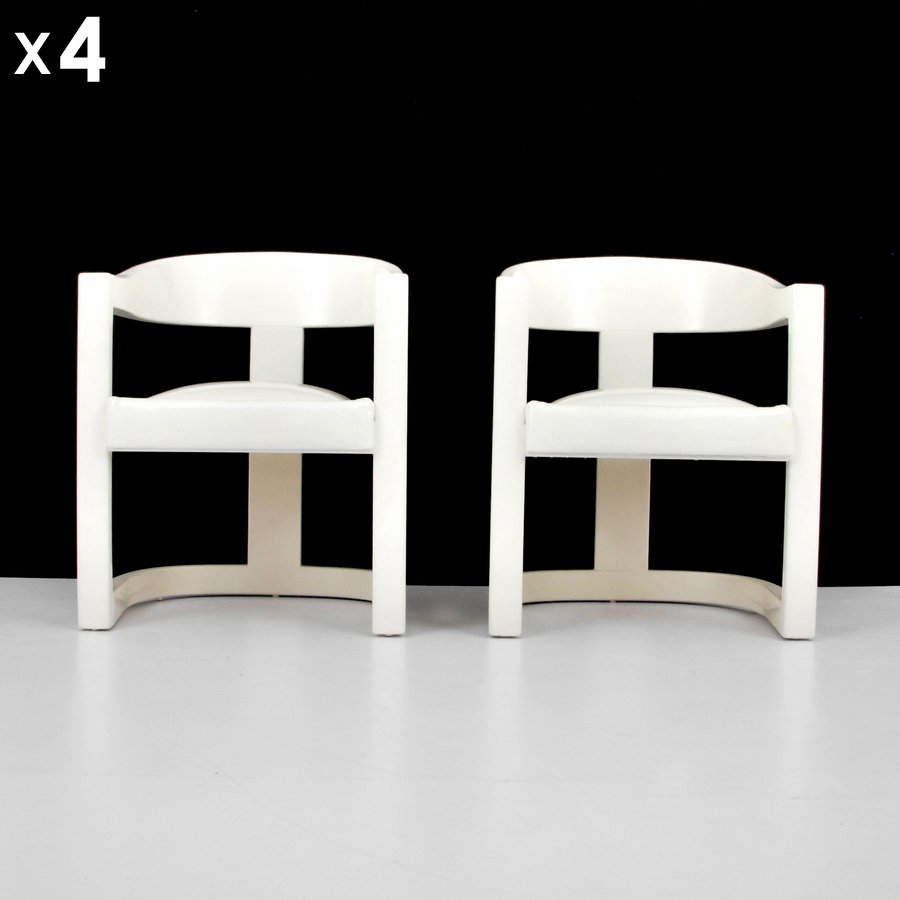 Karl Springer "Onassis" Arm Chairs, Set of 4: Designer & Manufacturer: Karl Springer; Karl Springer, Ltd. Markings: none Country of Origin & Materials: USA; patent leather, wood Additional Information & Circa: Set of four "Onassis" armed dining/s