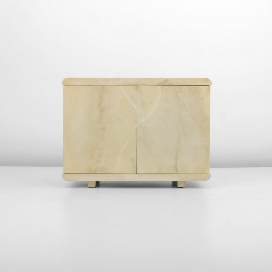 Lacquered Goatskin Cabinet, Manner of Karl Springer: Designer & Manufacturer: Karl Springer, Manner of Markings: none Country of Origin & Materials: unknown; lacquered goatskin, wood Additional Information & Circa: Two-door lacquered goatskin cabinet wi