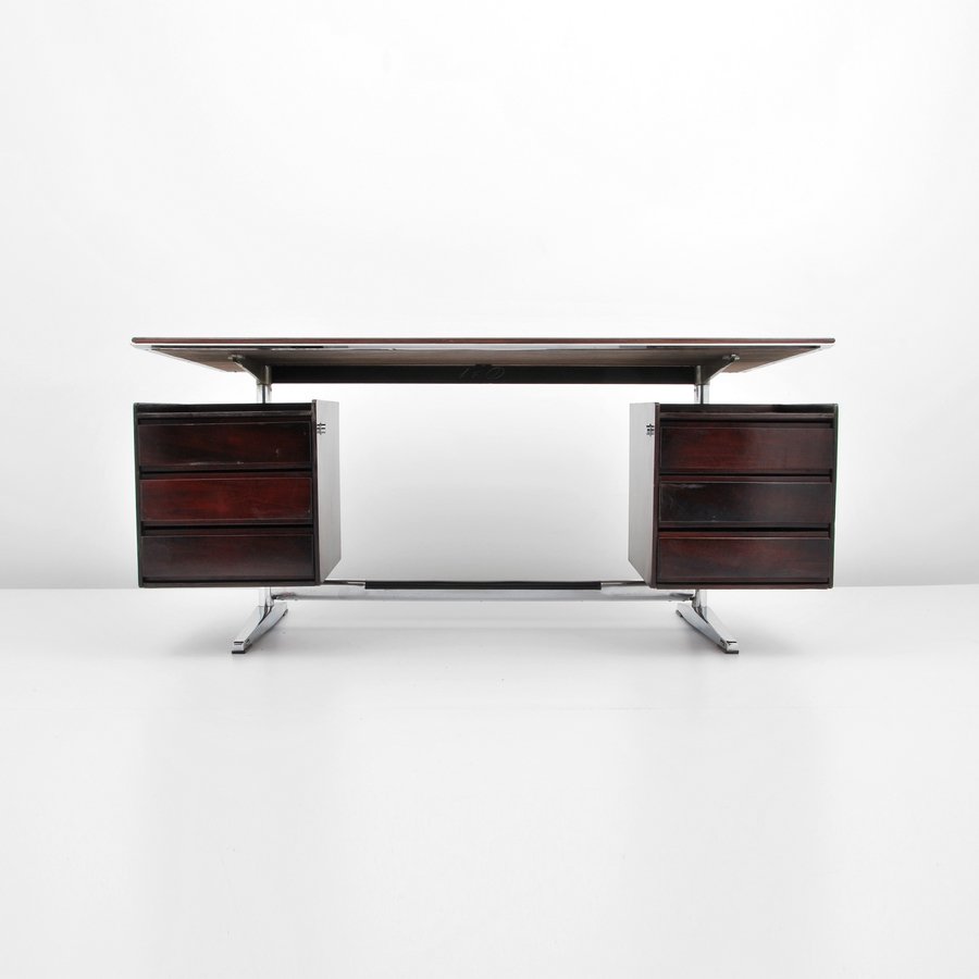 Gio Ponti Rosewood Desk: Designer & Manufacturer: Gio Ponti; Rima Markings: marked Country of Origin & Materials: Italy; rosewood, chromed steel, plastic Additional Information & Circa: Rosewood desk with six drawers by Gio P