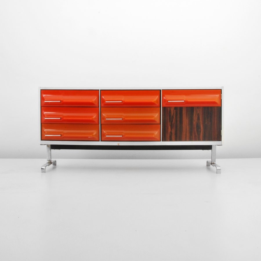 Cabinet, Manner of Raymond Loewy, Treco: Designer & Manufacturer: Raymond Loewy, Manner of; Treco Markings: none Country of Origin & Materials: Canada; plastic, metal, rosewood Additional Information & Circa: Cabinet with six drawers and one