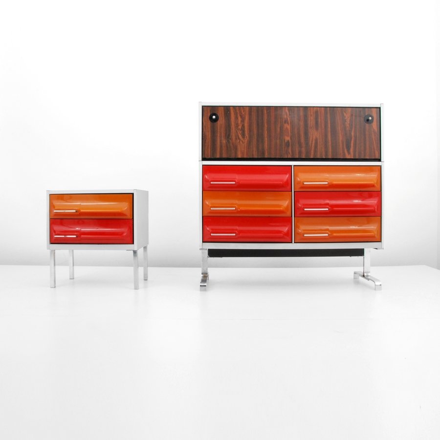 Cabinet & Nightstand, Manner of Raymond Loewy, Treco: Designer & Manufacturer: Raymond Loewy, Manner of; Treco Markings: none Country of Origin & Materials: Canada; plastic, metal, mica, rosewood Additional Information & Circa: Cabinet with six drawers a