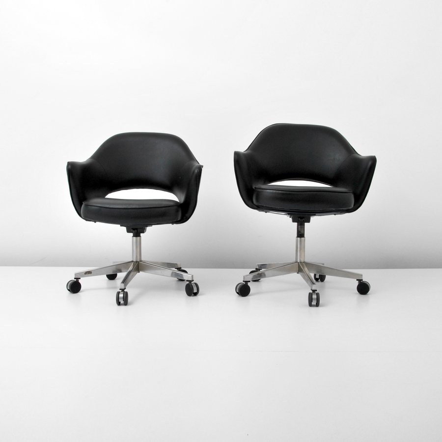 Pair of Eero Saarinen Adjustable Chairs, Knoll: Designer & Manufacturer: Eero Saarinen; Knoll Inc. Markings: marked Country of Origin & Materials: USA; metal, upholstery Additional Information & Circa: Pair of adjustable swivel arm chairs, Model 71