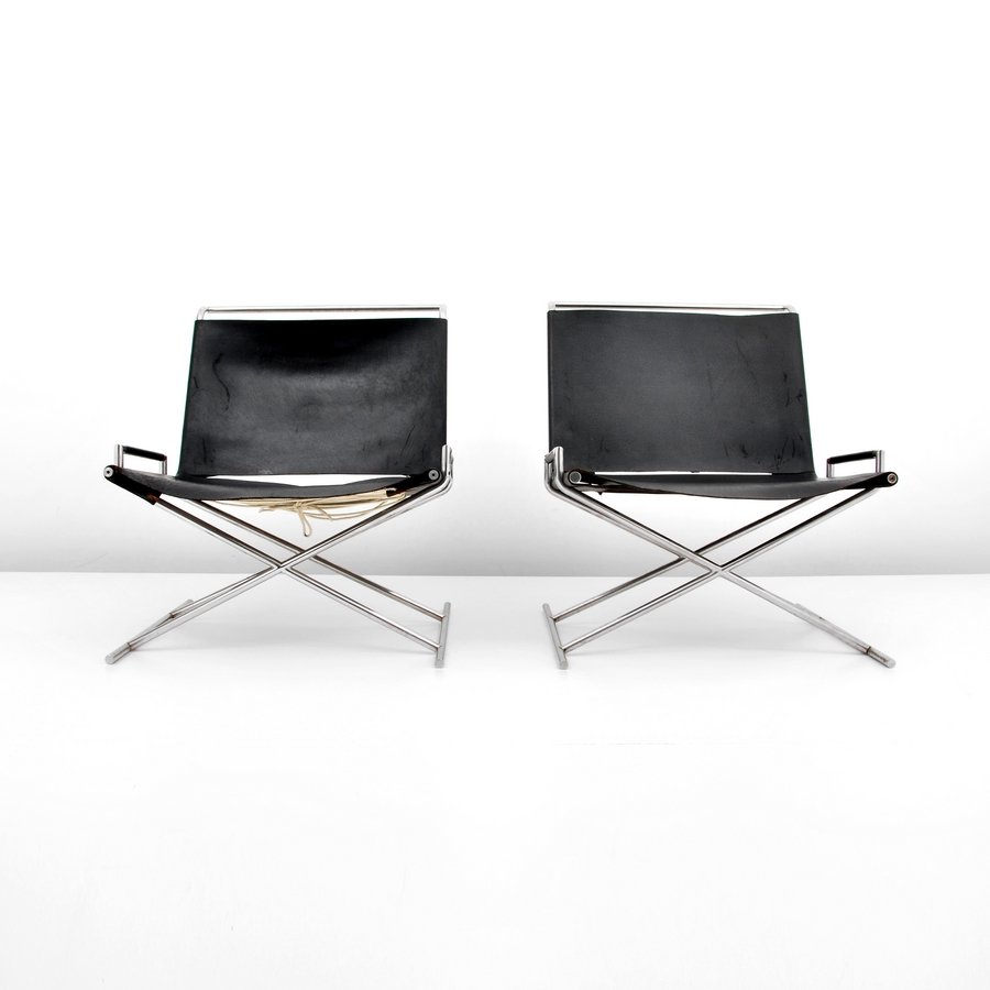 Pair of Ward Bennett "Sled" Lounge Chairs: Designer & Manufacturer: Ward Bennett; Brickel Associates Markings: none Country of Origin & Materials: USA; stainless steel, leather Additional Information & Circa: Pair of leather "Sled" chairs by W
