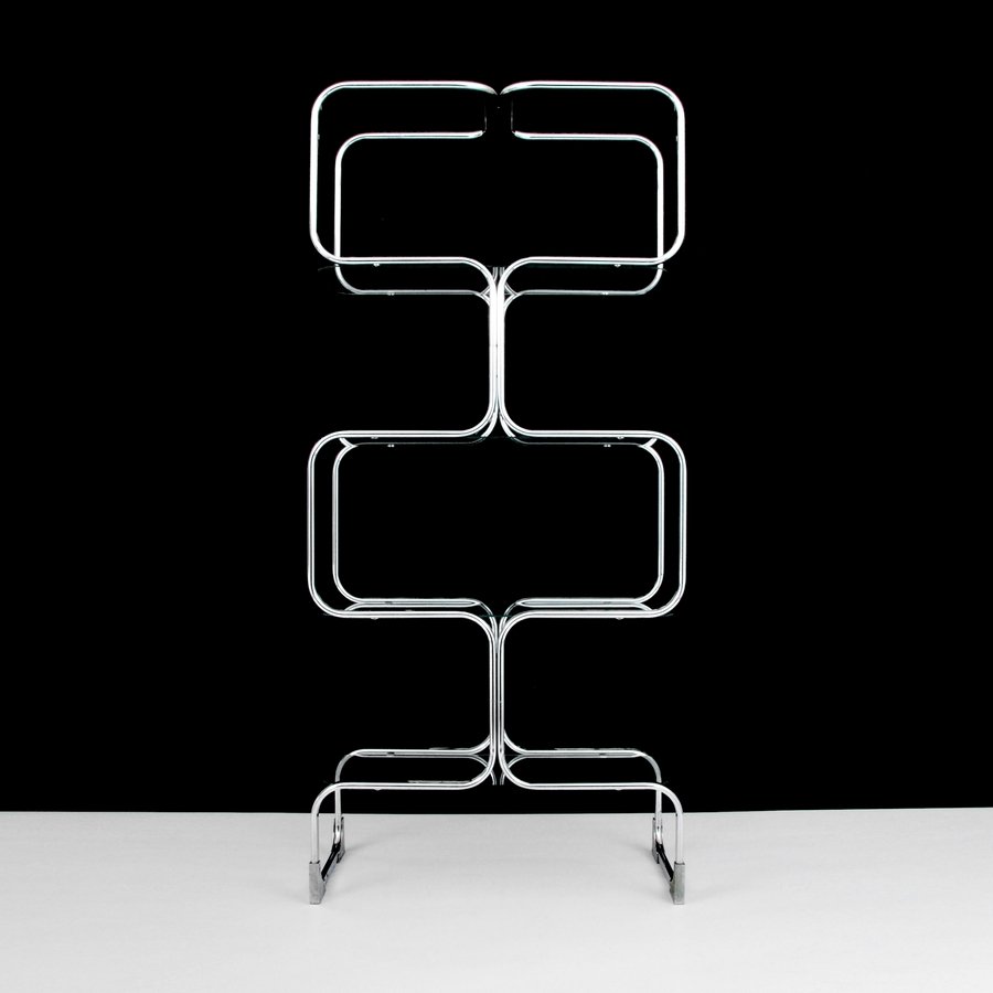 Chrome Étagère, Manner of Milo Baughman: Designer & Manufacturer: Milo Baughman, Manner of Markings: none Country of Origin & Materials: USA; chromed metal, glass Additional Information & Circa: Chrome étagère with four shelves in the mann