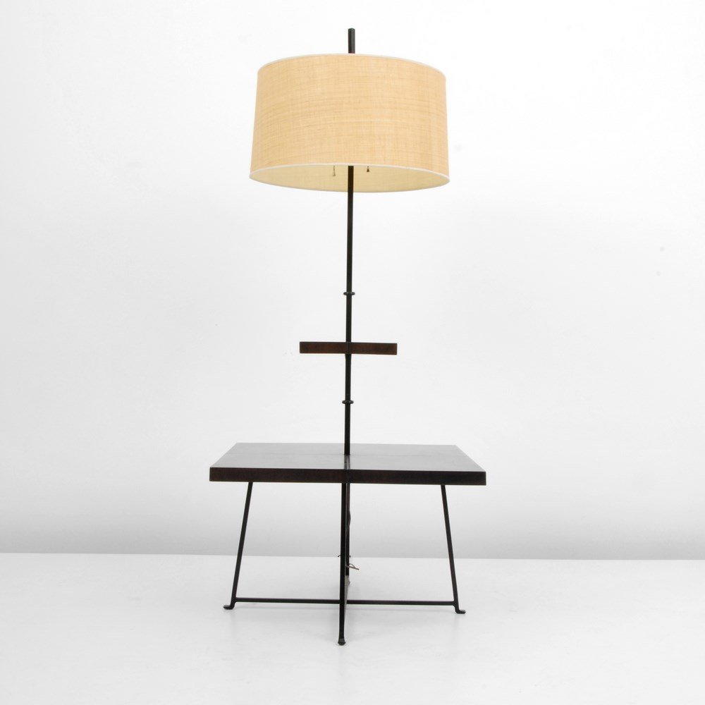 Tommi Parzinger Floor Lamp: Designer & Manufacturer: Tommi Parzinger; Parzinger Originals Markings: marked Country of Origin & Materials: USA; wood, metal Additional Information & Circa: Floor lamp with two shelves by Tommi Parz