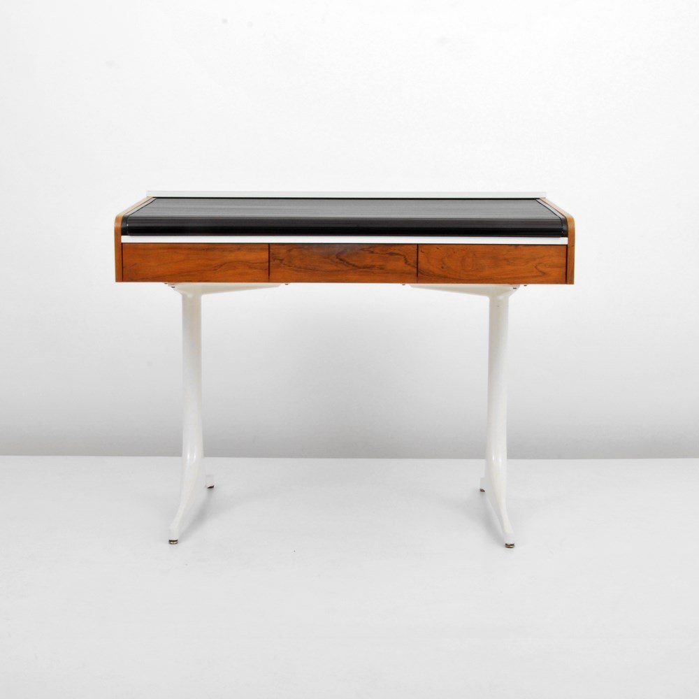 Desk in the Manner of George Nelson: Designer & Manufacturer: George Nelson, Manner of Markings: none Country of Origin & Materials: USA; wood, plastic, metal, mica Additional Information & Circa: Roll-top desk with three drawers and int