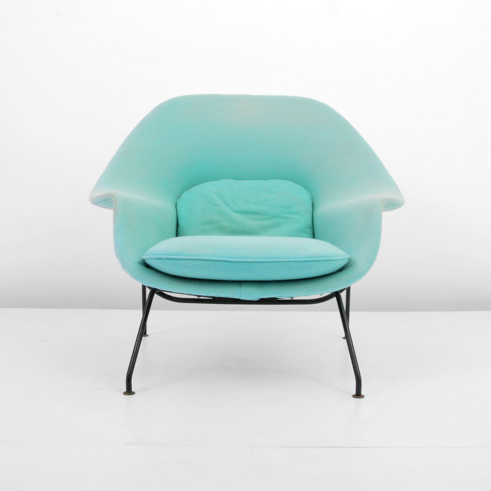 Eero Saarinen "Womb" Lounge Chair: Designer & Manufacturer: Eero Saarinen; Knoll International Markings: none Country of Origin & Materials: USA; metal, upholstery Additional Information & Circa: "Womb" lounge chair by Eero Saarinen. (