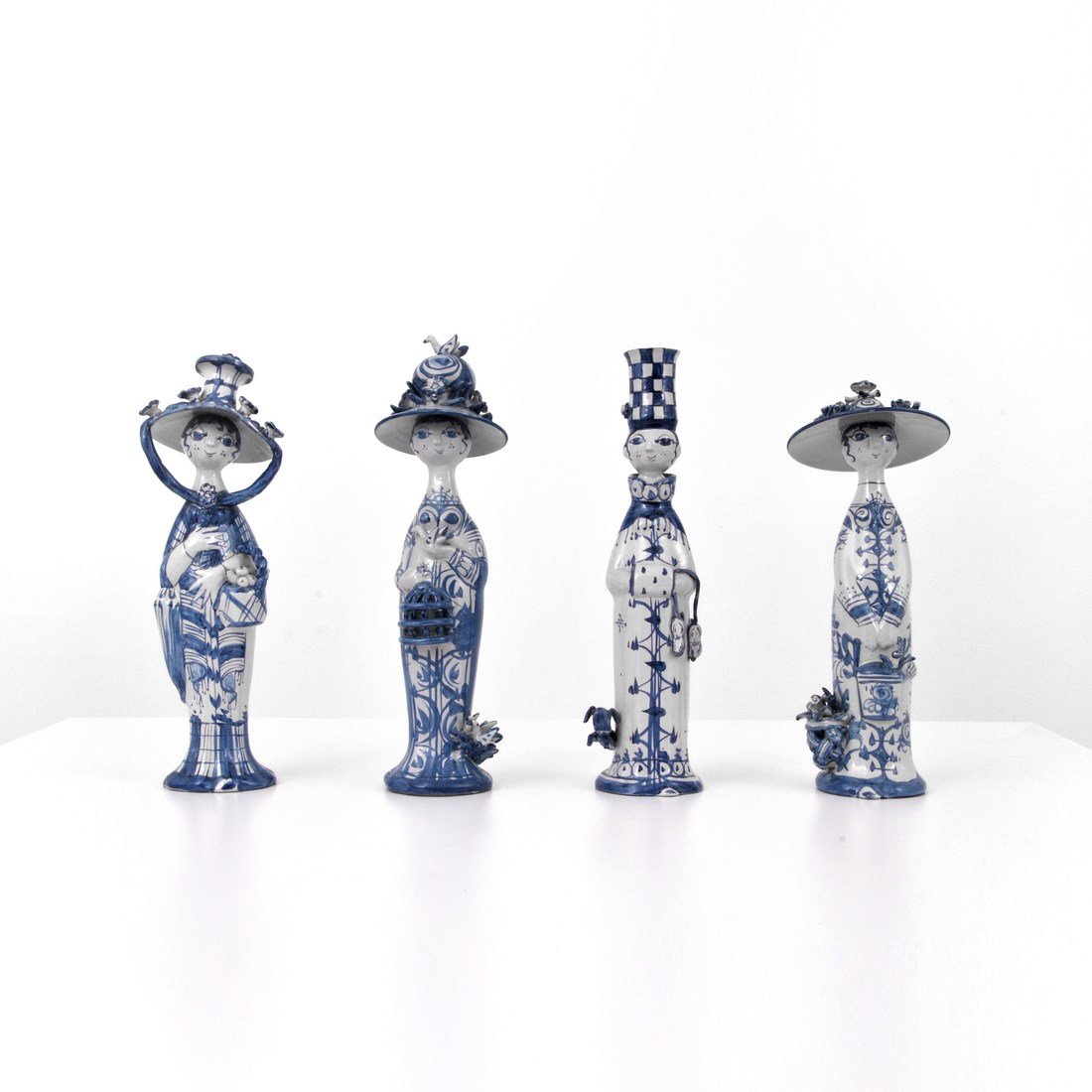 Bjørn Wiinblad 'The Four Seasons' Figurines: Designer & Manufacturer: Bjørn Wiinblad; Wiinblad Studio Markings: marked Country of Origin & Materials: Denmark; glazed and hand-painted stoneware Additional Information & Circa: Collection 'The Fou