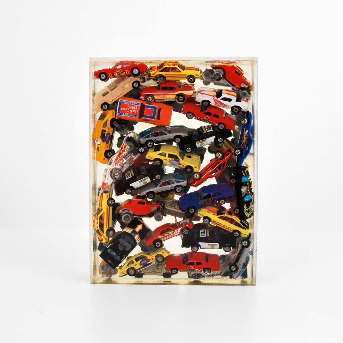Arman Sculpture, Signed Edition: Designer & Manufacturer: Arman Markings: signed; ed. 39/75 Country of Origin & Materials: French; acrylic, metal, other Additional Information & Circa: Large sculpture with toy cars suspended in acryl