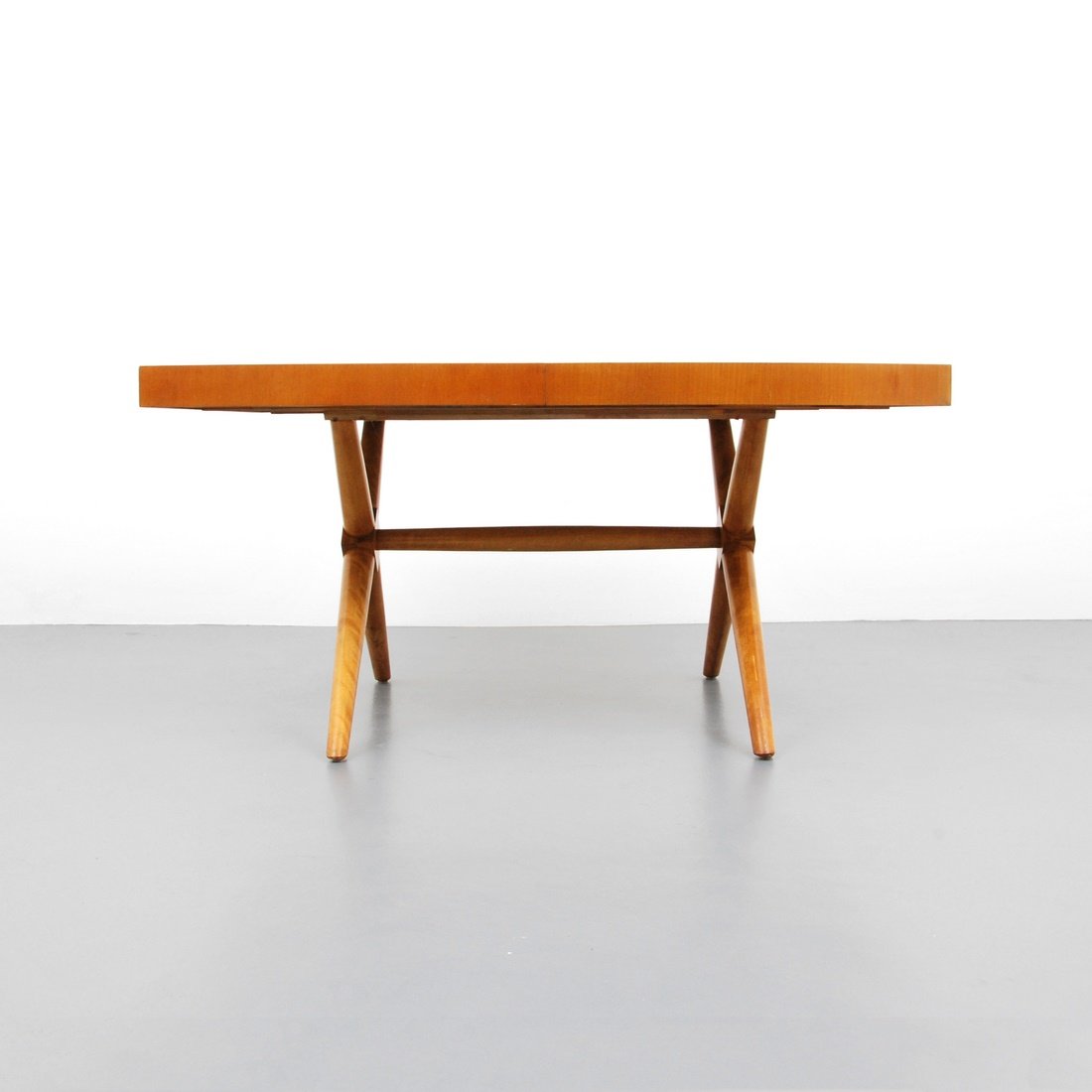 T.H. Robsjohn-Gibbings Dining Table: Designer & Manufacturer: T.H. Robsjohn-Gibbings; Widdicomb Markings: marked Country of Origin & Materials: USA; walnut, maple Additional Information & Circa: Dining table 'X' form base with one 20" le