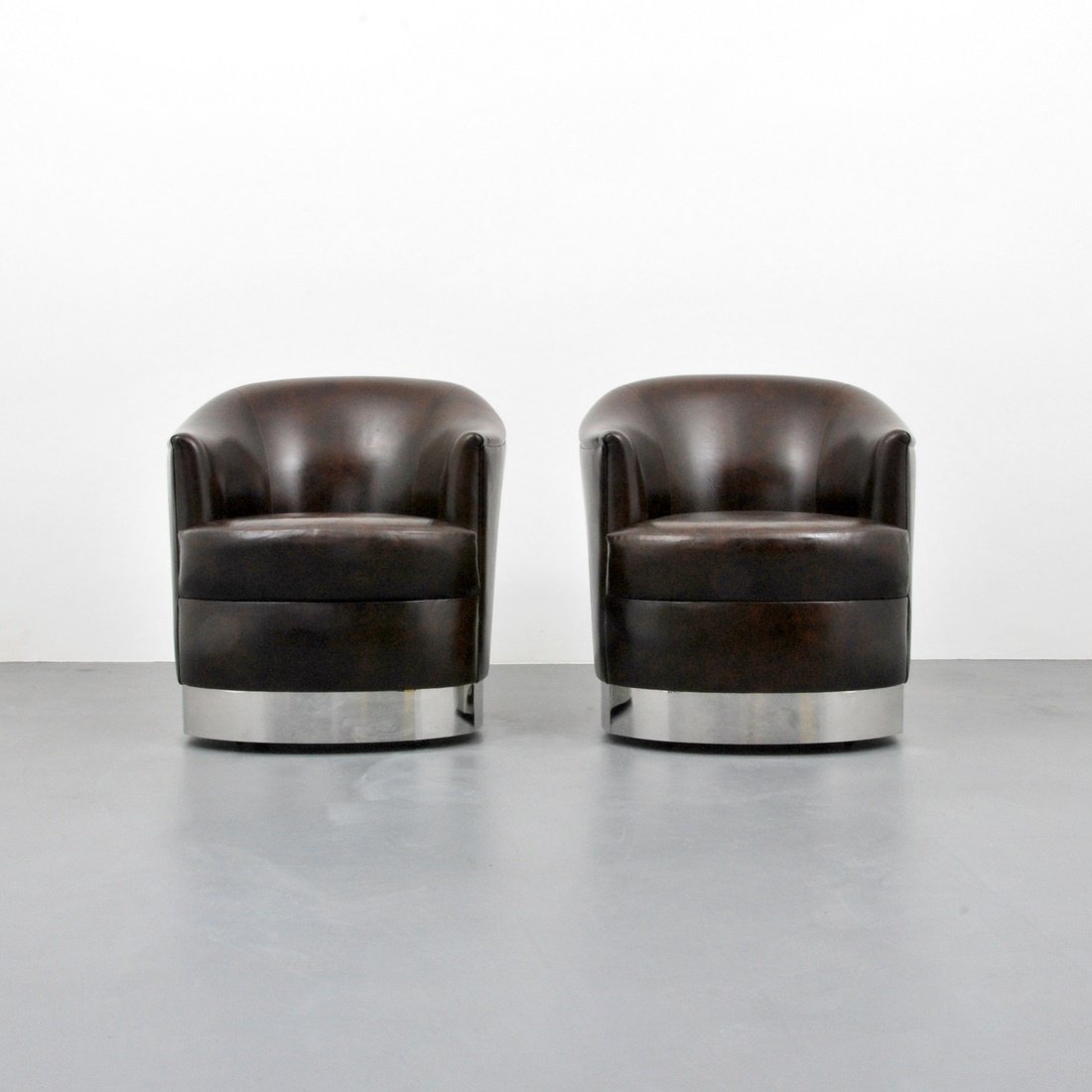 Karl Springer Wheeled Lounge Chairs: Designer & Manufacturer: Karl Springer; Karl Springer Ltd. Markings: none Country of Origin & Materials: USA; upholstery, chrome Additional Information & Circa: Pair of wheeled lounge chairs with chro