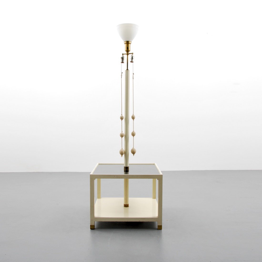 Tommi Parzinger Floor Lamp: Designer & Manufacturer: Tommi Parzinger; Parzinger Originals Markings: marked Country of Origin & Materials: USA; wood, laminate, brass Additional Information & Circa: Floor lamp with built-in table 