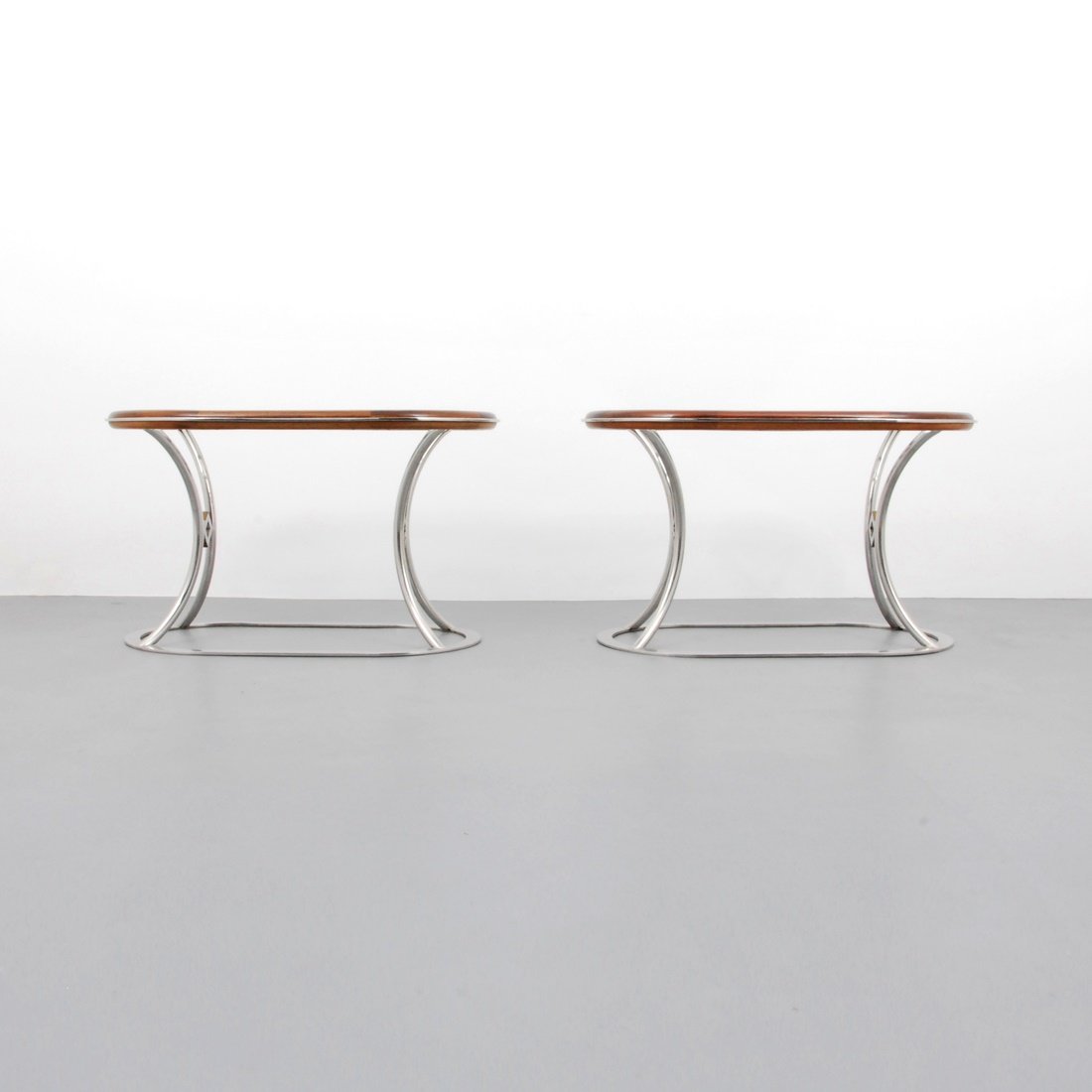 Alain Delon Occasional Tables: Designer & Manufacturer: Alain Delon; Maison Jansen Markings: none Country of Origin & Materials: France; steel, brass, mahogany Additional Information & Circa: Pair of large occasional/end tables by