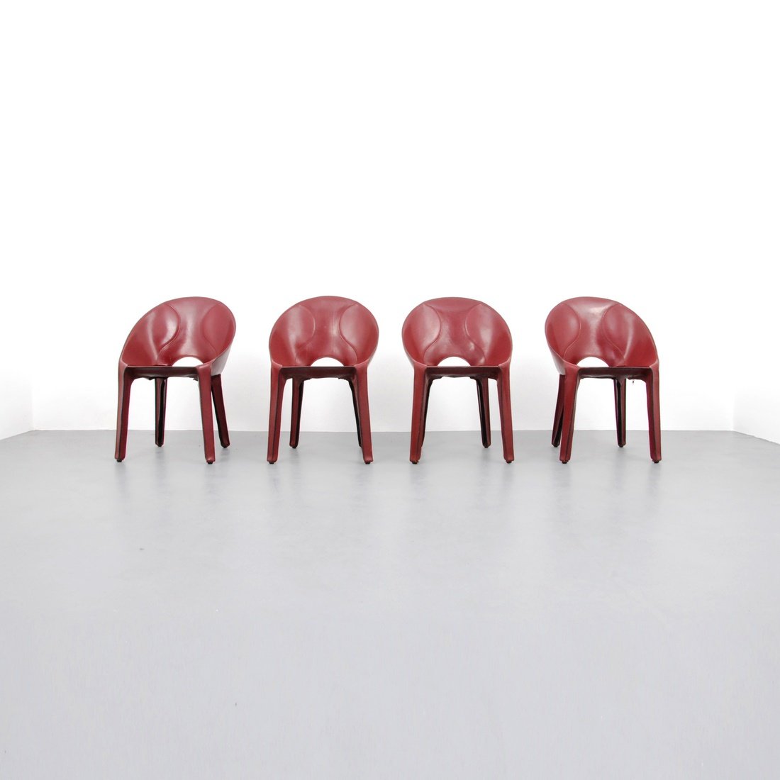 Mario Bellini 'Lira E Liuto' Leather Chairs: Designer & Manufacturer: Mario Bellini; Cassina Markings: marked Country of Origin & Materials: Italy; leather Additional Information & Circa: Set of four 'Lira E Liuto' dining chairs by Mario Bellini