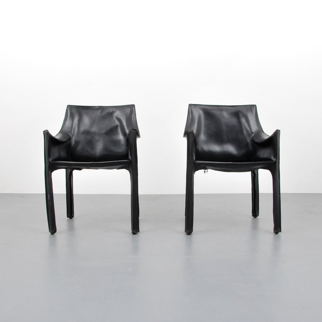 Mario Bellini 'Cab 413' Leather Chairs: Designer & Manufacturer: Mario Bellini; Cassina Markings: none Country of Origin & Materials: Italy; leather Additional Information & Circa: Pair of 'Cab 413' arm chairs by Mario Bellini. Reference: R