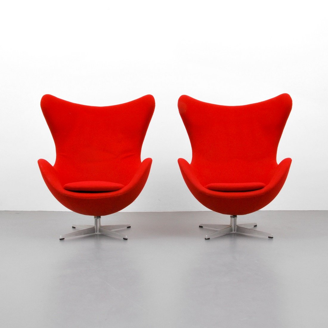Arne Jacobsen 'Egg' Chairs: Designer & Manufacturer: Arne Jacobsen; Fritz Hansen Markings: marked Country of Origin & Materials: Denmark; cast aluminum, upholstery Additional Information & Circa: Pair of early 'Egg' lounge chair