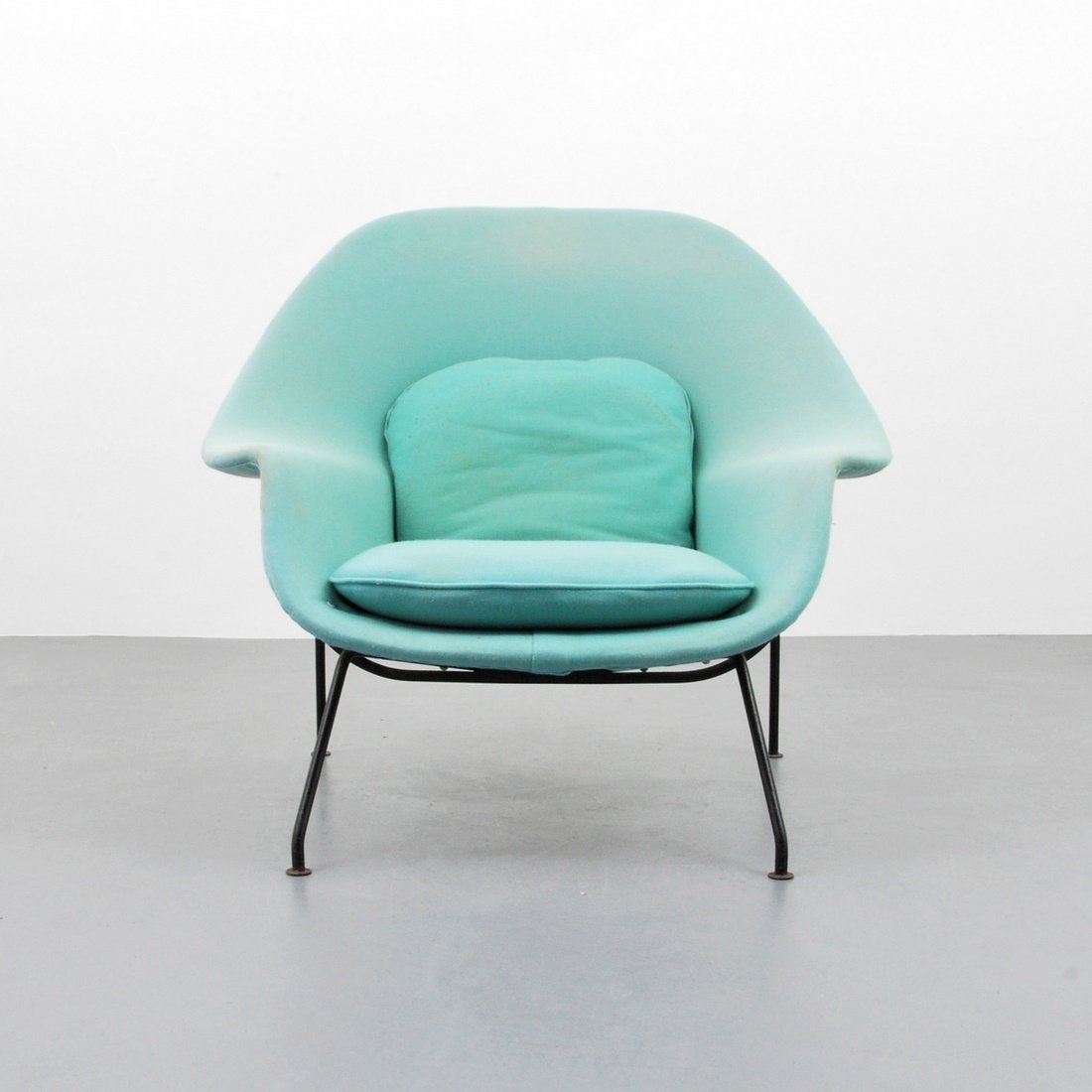 Eero Saarinen 'Womb' Lounge Chair: Designer & Manufacturer: Eero Saarinen; Knoll International Markings: none Country of Origin & Materials: USA; metal, upholstery Additional Information & Circa: Armed 'Womb' lounge chair, Model 70, by