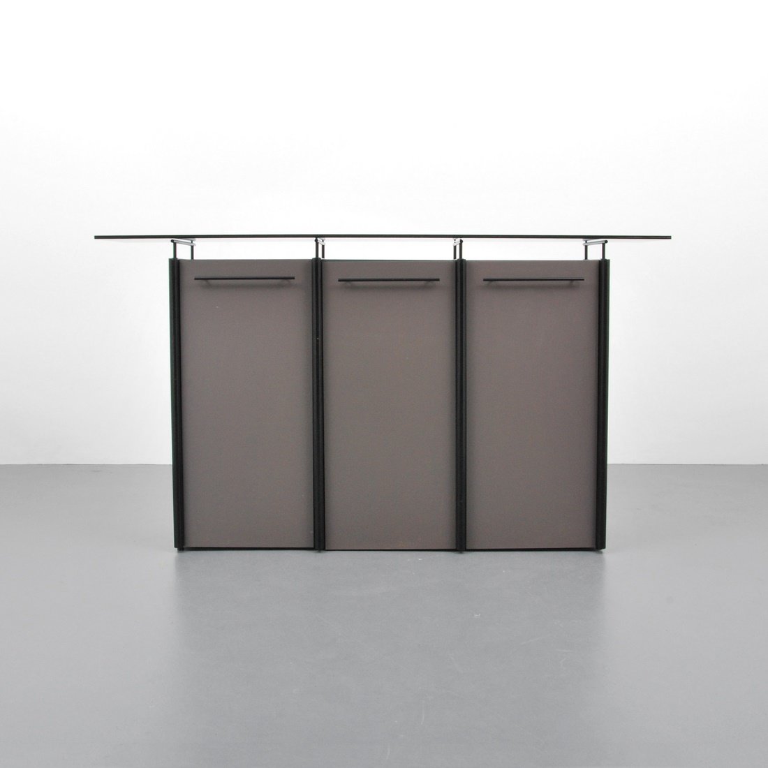 Ligne Roset Cabinet/Server: Designer & Manufacturer: Ligne Roset Markings: marked Country of Origin & Materials: France; glass, metal, laminate Additional Information & Circa: Cabinet/server/console with three doors each reveali