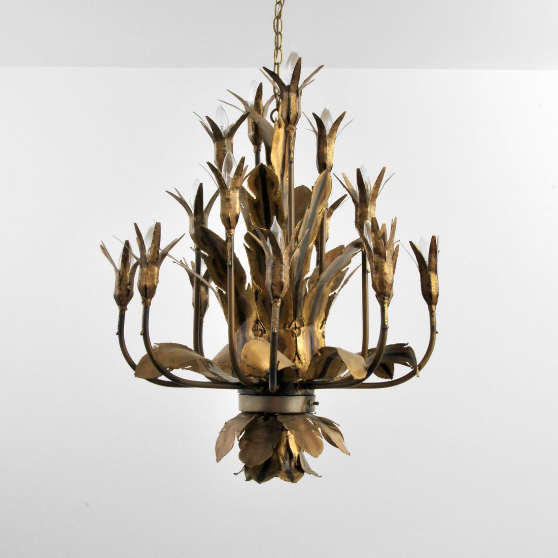 Large Tom Greene Brutalist Chandelier: Designer & Manufacturer: Tom Greene; The Feldman Company Markings: none Country of Origin & Materials: USA; metal Additional Information & Circa: Large brutalist pierced and burnished metal chandelier