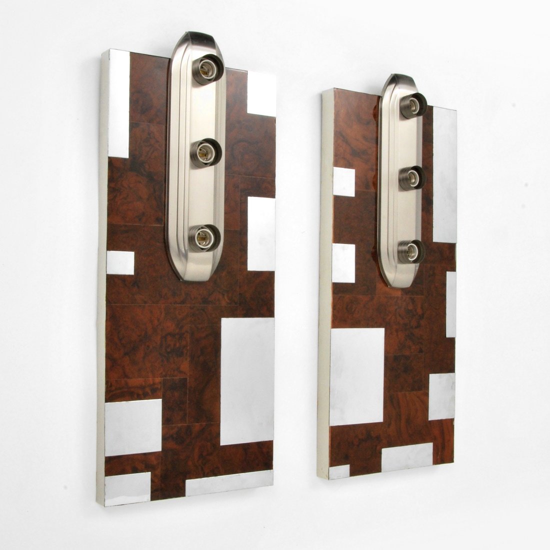Sconces 'Cityscape', Manner of Paul Evans: Designer & Manufacturer: Paul Evans, Manner of Markings: none Country of Origin & Materials: USA; chromed metal, burlwood, metal Additional Information & Circa: Pair of 'Cityscape' sconces in the mann