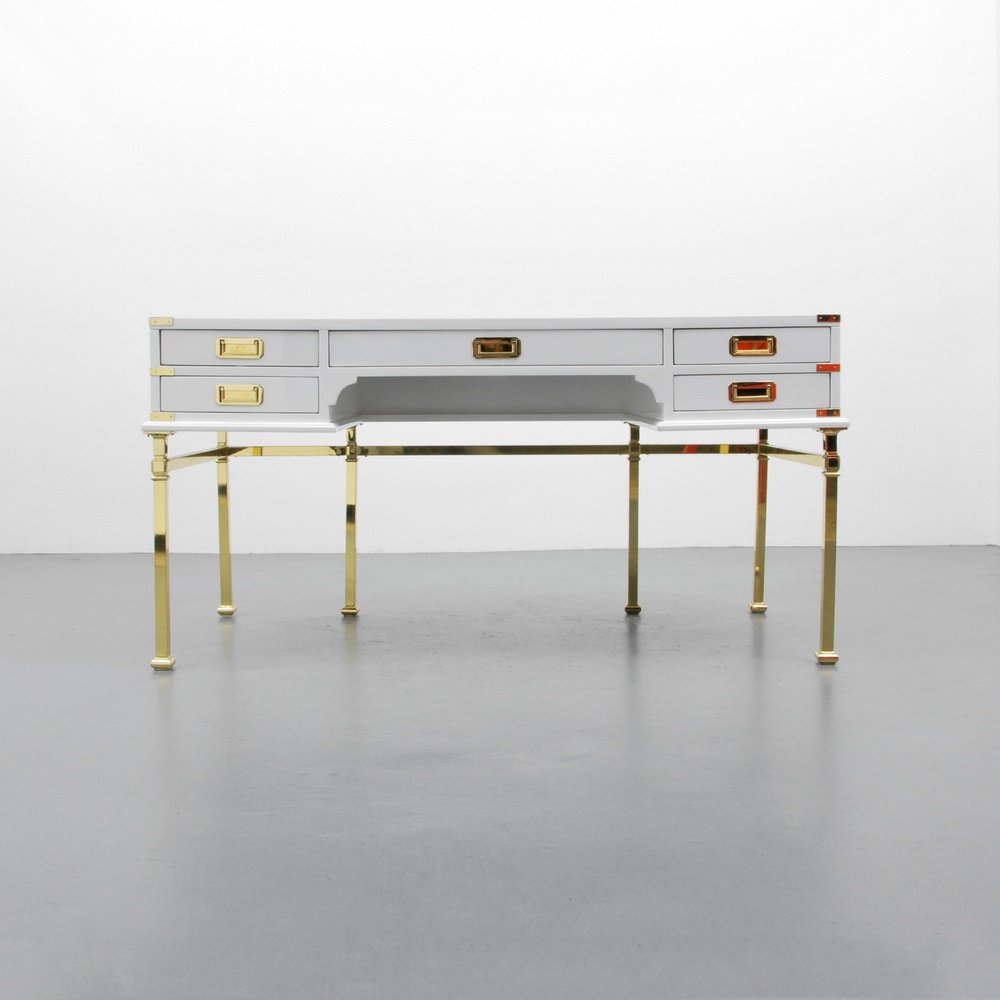 Campaign Desk, Manner of Tommi Parzinger: Designer & Manufacturer Sligh Furniture Co. Markings marked Country of Origin & Materials USA; wood, brass Additional Information & Circa Desk has five drawers and is finished on the back. (Key Word