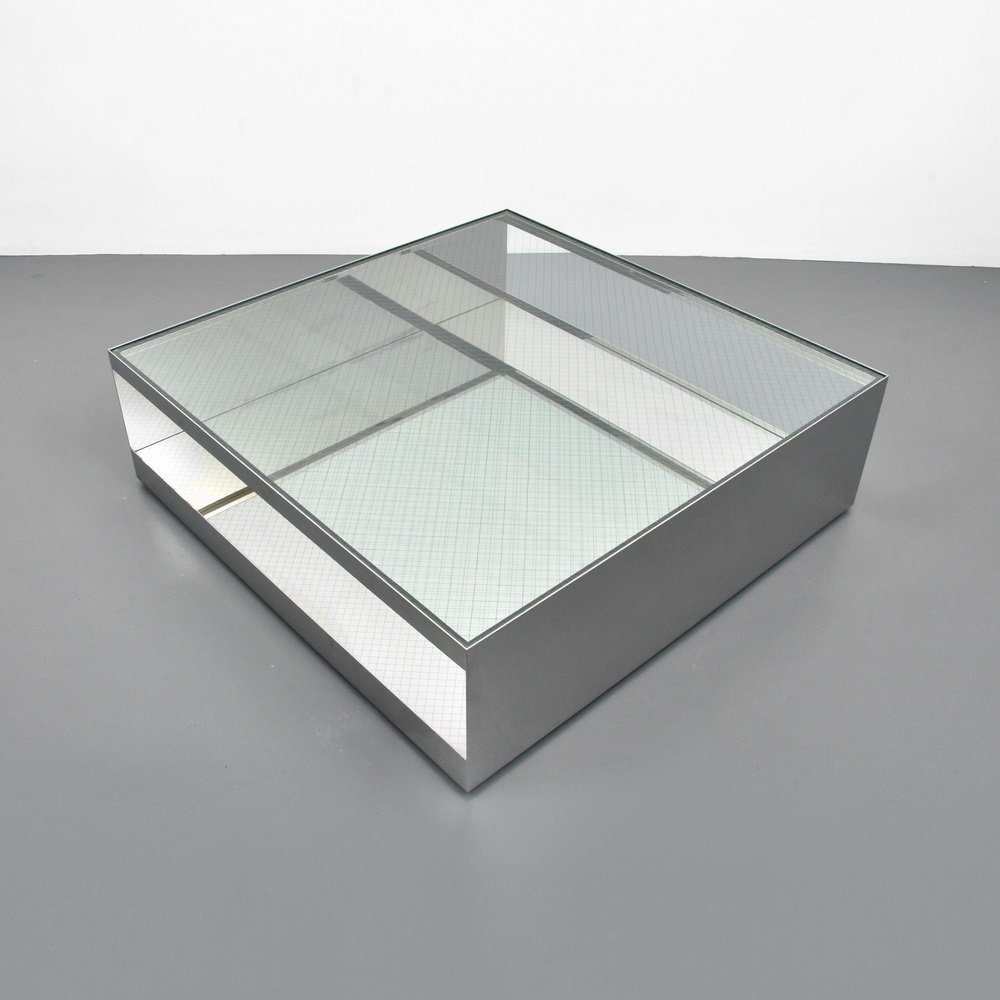 Large Joseph (Joe) D'Urso Coffee Table: Designer & Manufacturer Joseph (Joe) D'Urso; Knoll International Markings marked; 1982 Country of Origin & Materials USA; chromed metal, safety glass Additional Information & Circa Table is on wheel