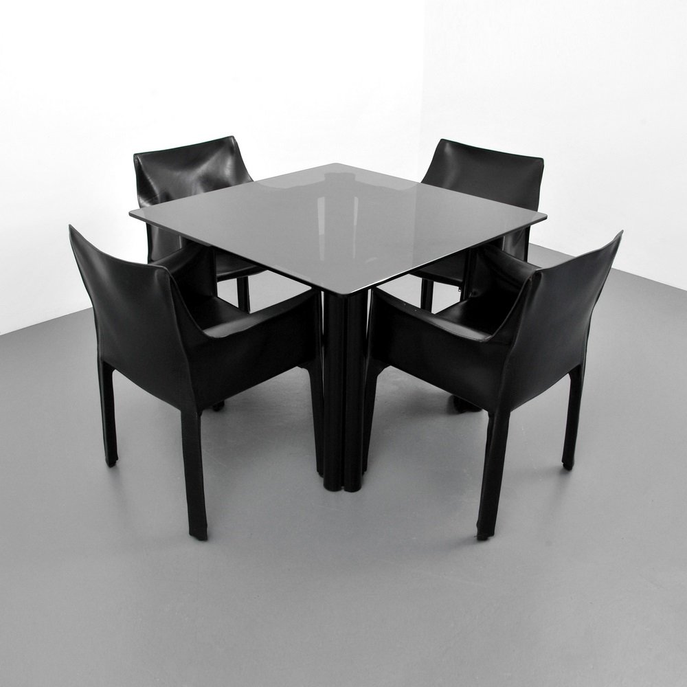 Mario Bellini Chairs & Acerbis Table: Designer & Manufacturer Mario Bellini (Cassina); Acerbis International (table) Markings marked Country of Origin & Materials Italy; leather, glass Additional Information & Circa Set of four "Cab" ch