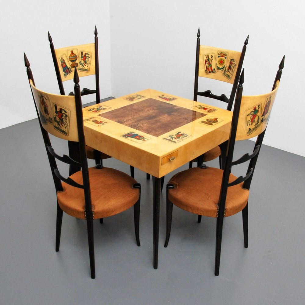 Rare Aldo Tura Game Table & Chairs: Designer & Manufacturer Aldo Tura Markings none Country of Origin & Materials Italy; wood, upholstery, goatskin Additional Information & Circa Four tall-back chairs with decorated backs. Decorated t