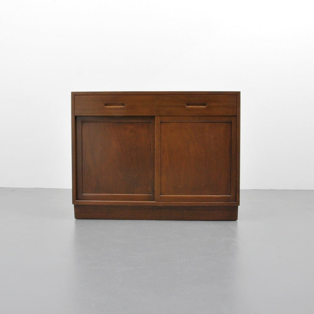 Edward Wormley Cabinet: Designer & Manufacturer Edward Wormley; Dunbar Markings marked Country of Origin & Materials USA; mahogany Additional Information & Circa Variation of model 5668, two drawers with separators, two do