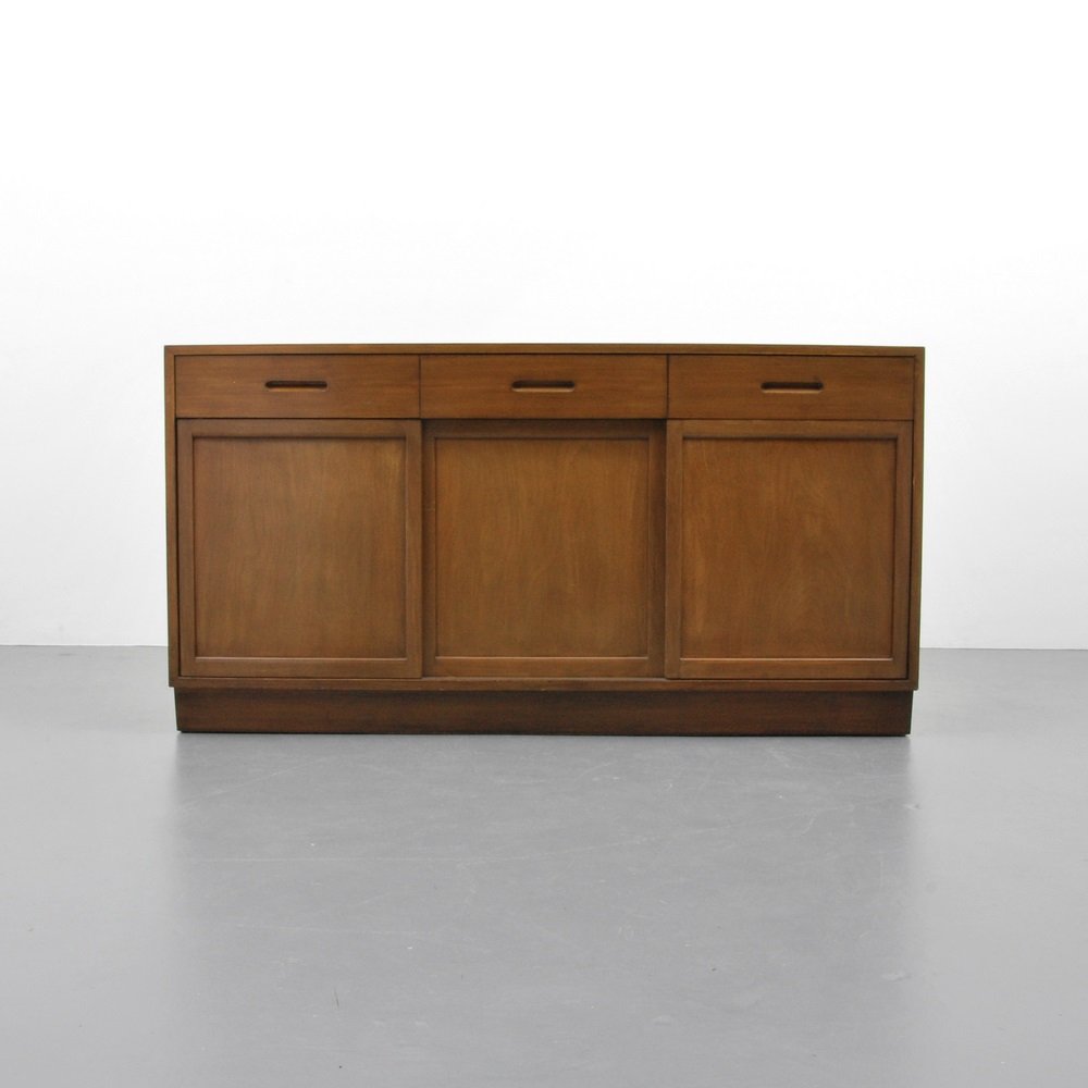 Edward Wormley Cabinet: Designer & Manufacturer Edward Wormley; Dunbar Markings none Country of Origin & Materials USA; mahogany Additional Information & Circa Variation of model 5668, three drawers with separators, two en