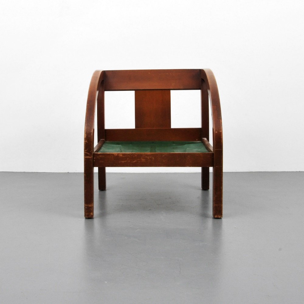 Paul Frankl "D" Lounge Chair: Designer & Manufacturer Paul Frankl Markings none Country of Origin & Materials USA; wood Additional Information & Circa (Key Word Search: Baker, Edward Wormley, Dunbar, Harvey Probber, T.H. Robsjoh