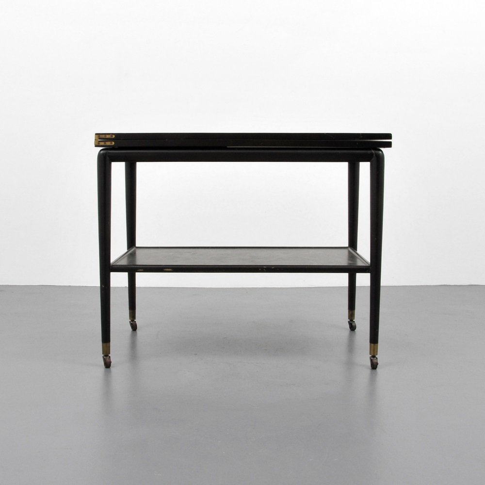 T.H. Robsjohn-Gibbings Cart/Server: Designer & Manufacturer T.H. Robsjohn Gibbings, Widdicomb Markings marked Country of Origin & Materials USA; wood Additional Information & Circa Cart/server with lower shelf and flip-top, on wheels.