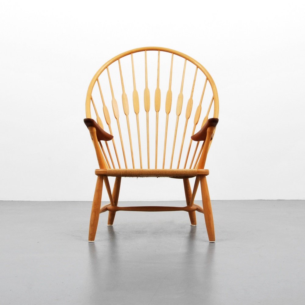 Hans Wegner "Peacock" Chair: Designer & Manufacturer Hans Wegner; Johannes Hansen Markings marked Country of Origin & Materials Denmark; rush, wood Additional Information & Circa Chair is model JH 550. Reference: Hans Wegner's