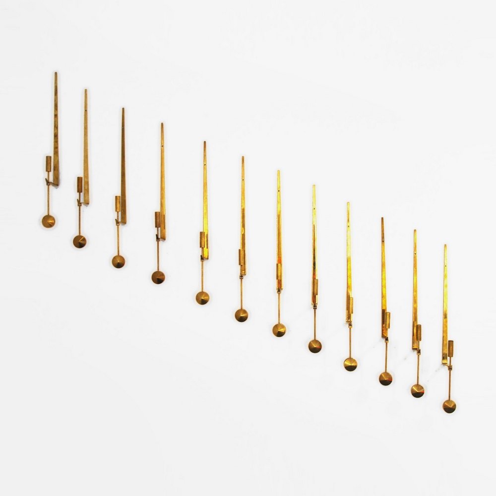Pierre Forsell Lampett Wall Appliques: Designer & Manufacturer Pierre Forsell; Skultuna Markings marked Country of Origin & Materials Sweden; brass Additional Information & Circa Set of twelve wall appliques/candle holders. (Key Word Sea