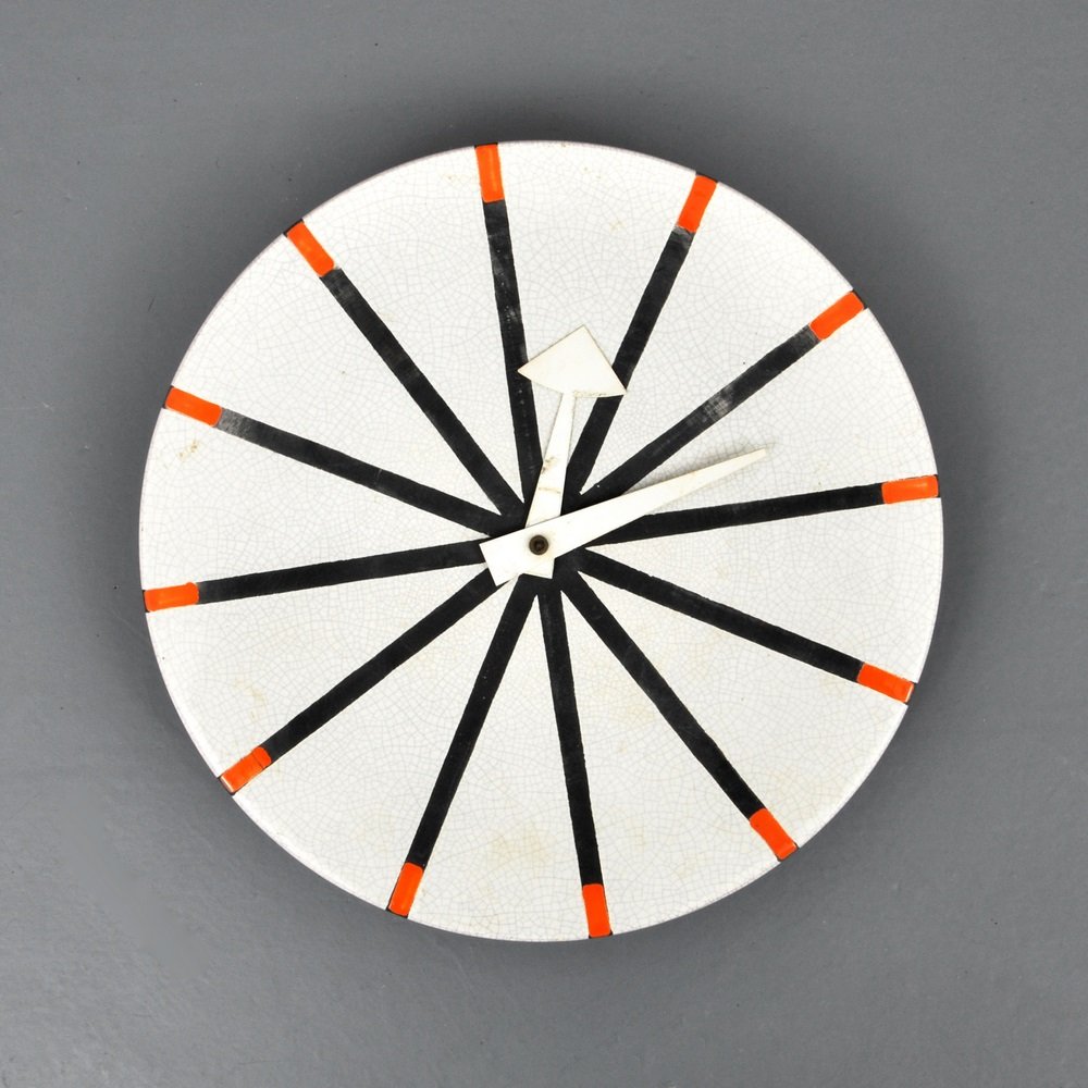 George Nelson & Associates Meridian Wall Clock: Designer & Manufacturer George Nelson & Associates; Howard Miller Clock Co./Meridian Markings marked Country of Origin & Materials Italy/USA; glazed ceramic, aluminum Additional Information & Circa
