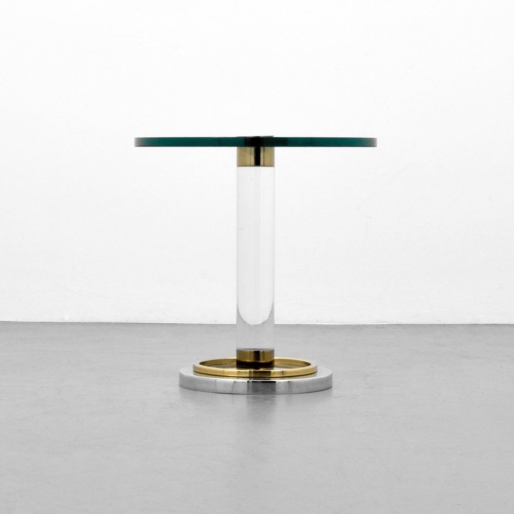 Charles Hollis Jones Occasional Table: Designer (Artist) & Manufacturer: Charles Hollis Jones Markings: none Country of Origin & Materials: USA; glass, Lucite, chromed metal, brass Additional Information: (Key Word Search: Lion Leon Frost,
