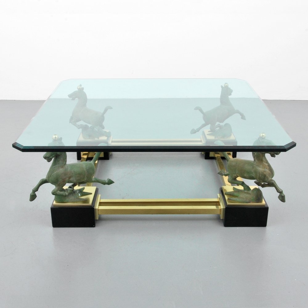 Coffee Table, Manner of Maison Jansen: Designer (Artist) & Manufacturer: Maison Jansen, Manner of Markings: none Country of Origin & Materials: unknown; brass, metal, other Additional Information: Table has four horse-shaped supports. (Key