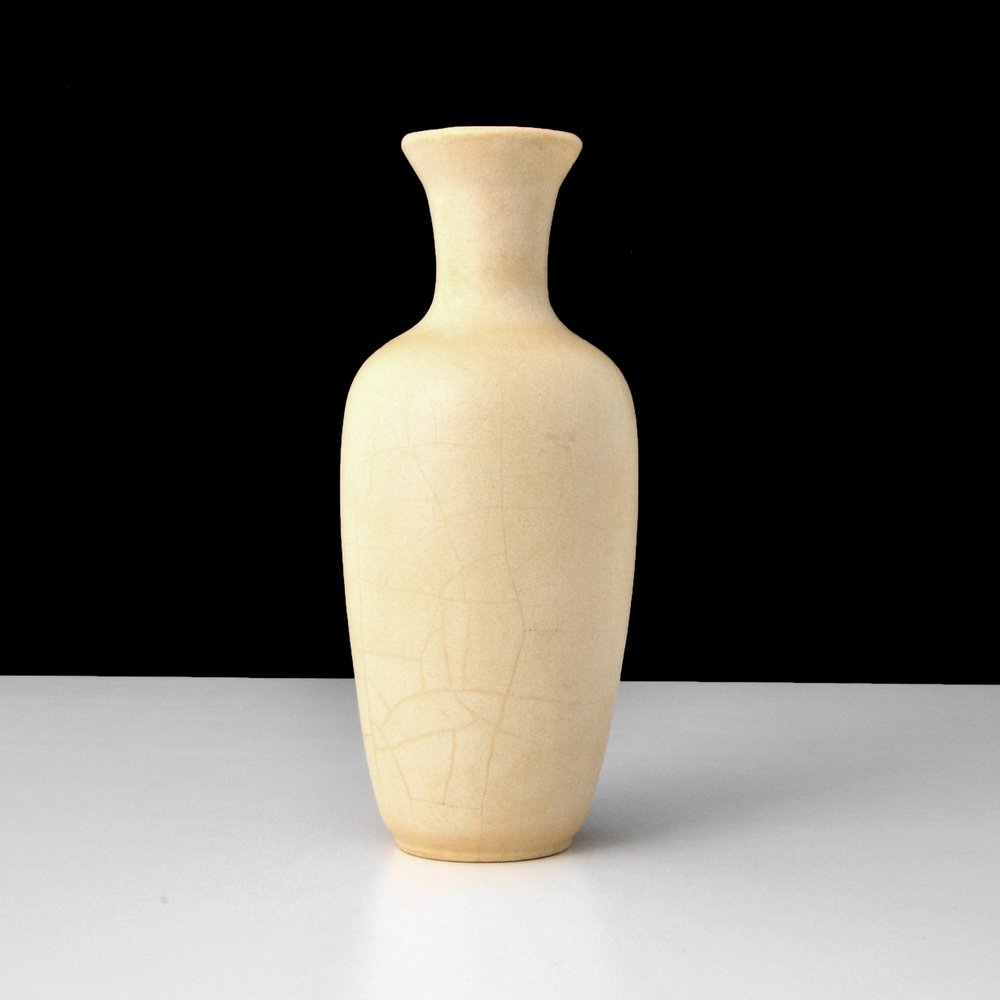 William Gates Vase, TECO Pottery: Designer (Artist) & Manufacturer: William Gates Vase; TECO Markings: marked Country of Origin & Materials: USA; pottery Additional Information: Vase is shape #64B with matte ivory glaze (possibly an e