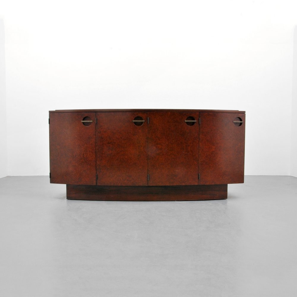 Gilbert Rohde "Formal Dining Group" Server: Designer (Artist) & Manufacturer: Gilbert Rohde; Herman Miller Markings: marked Country of Origin & Materials: USA; Maidou burl, mahogany, metal Additional Information: Art Deco server/cabinet has two