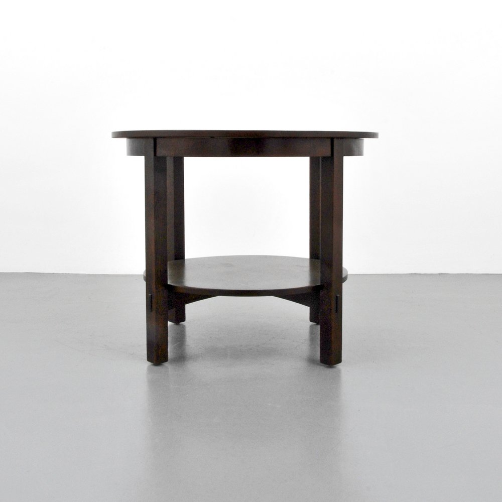 Stickley Brothers Table: Designer (Artist) & Manufacturer: Stickley Brothers Markings: none Country of Origin & Materials: USA; oak Additional Information: Two-tier form with through-tenons and pegging. (Key Word Search: Gust