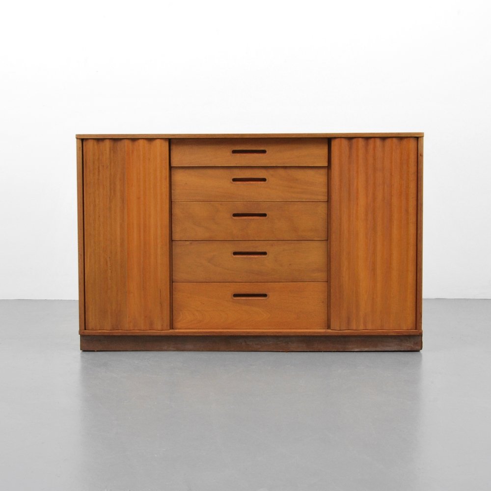 Edward Wormley Cabinet: Designer (Artist) & Manufacturer: Edward Wormley; Dunbar Markings: marked Country of Origin & Materials: USA; wood Additional Information: Cabinet features five drawers and two wavy front doors each r