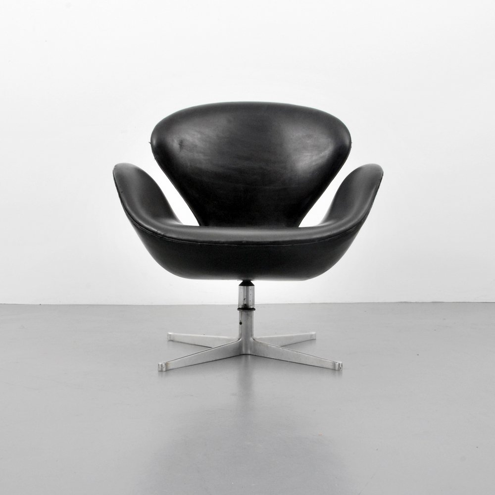 Early Arne Jacobsen "Swan" Chair: Designer (Artist) & Manufacturer: Arne Jacobsen; Fritz Hansen Markings: marked Country of Origin & Materials: Denmark; cast aluminum, upholstery Additional Information: Lounge chair swivels. Reference