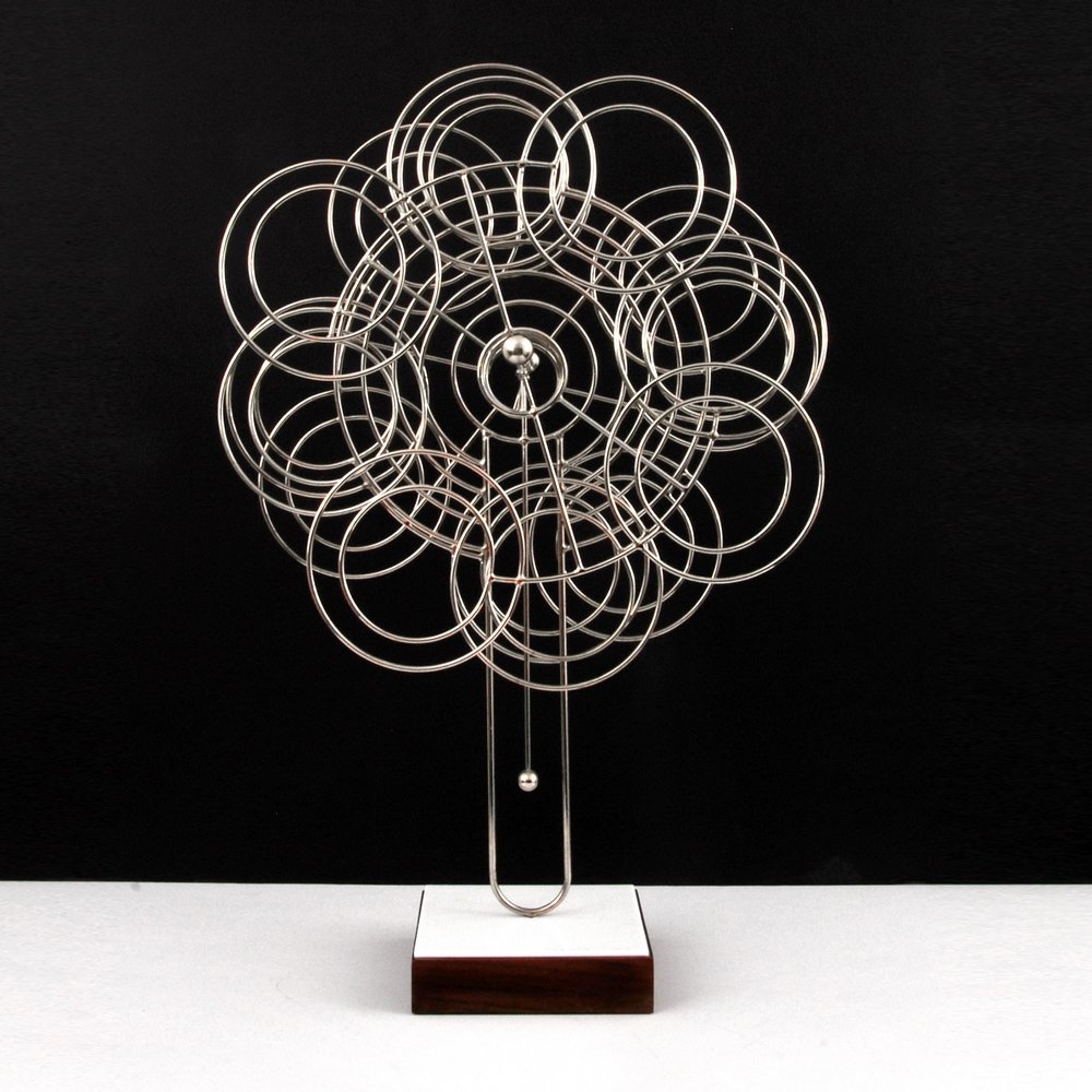Joseph Burlini Kinetic Sculpture: Designer (Artist) & Manufacturer: Joseph Burlini (b. 1973) Markings: signed; 1977 Country of Origin & Materials: American; metal, wood, plastic Dimensions: 31"h, 20"w, 7.75"d