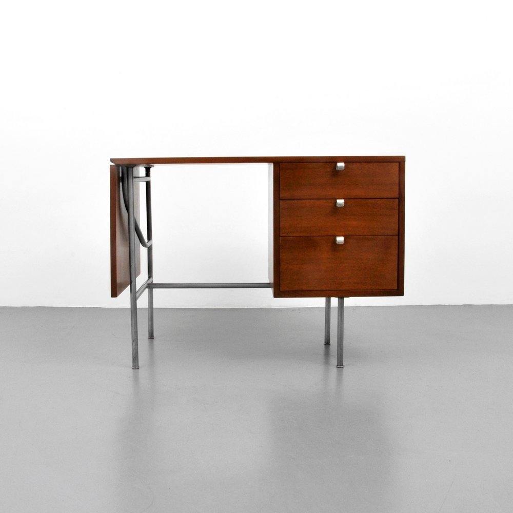 George Nelson Desk: Designer (Artist) & Manufacturer: George Nelson; Herman Miller Markings: marked Country of Origin & Materials: USA; metal, wood Additional Information: Desk has three drawers and a drop leaf. (Key Wor