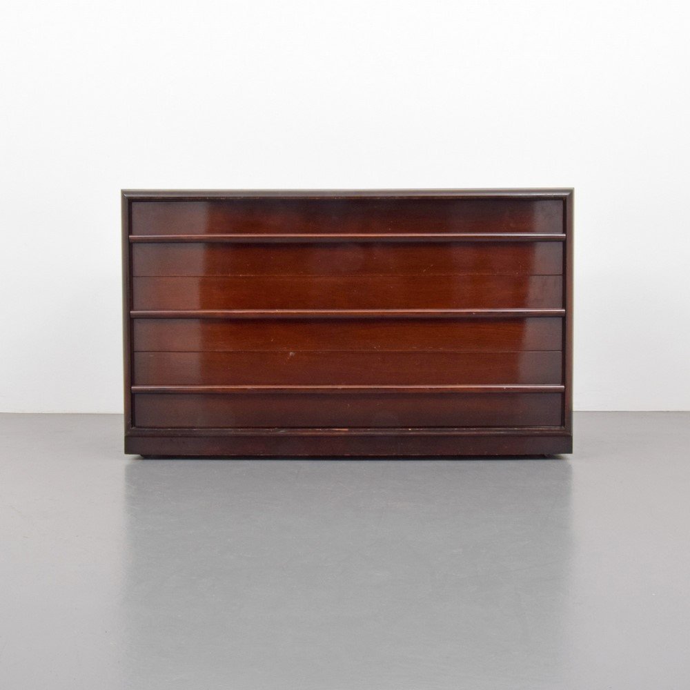 T.H. Robsjohn-Gibbings Cabinet/Dresser: Designer & Manufacturer: T.H. Robsjohn-Gibbings; Widdicomb Markings: none Country of Origin & Materials: USA; mahogany Additional Information & Circa: Wheeled cabinet with three drawers. (Key Word Sea