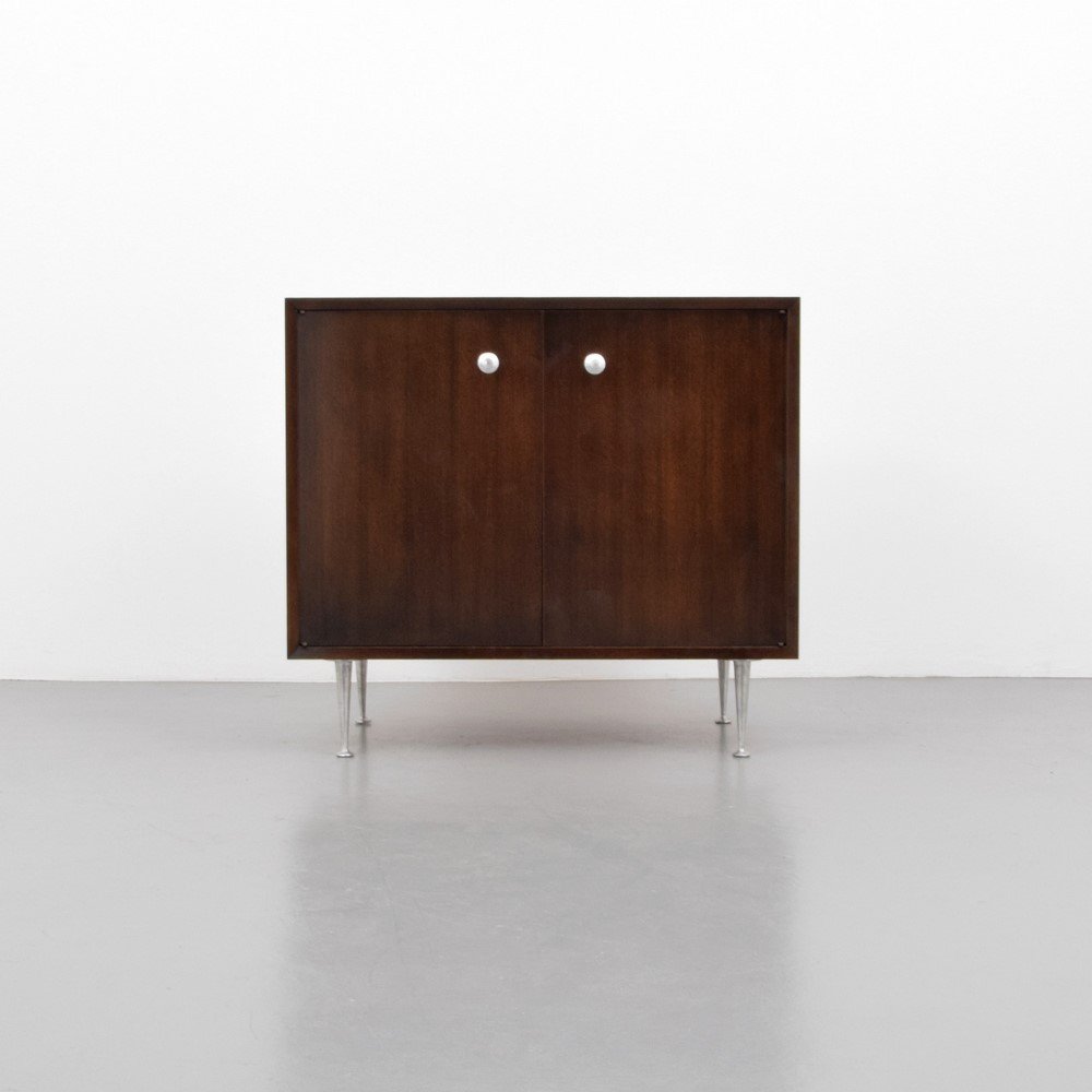 George Nelson "Thin Edge" Cabinet: Designer & Manufacturer: George Nelson; Herman Miller Markings: marked Country of Origin & Materials: USA; aluminum, wood Additional Information & Circa: Cabinet with two doors revealing an adjustable