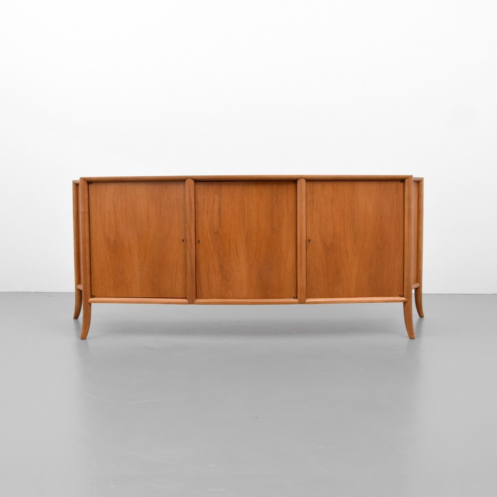 T.H. Robsjohn Gibbings Cabinet: Designer & Manufacturer: T.H. Robsjohn Gibbings; Widdicomb Markings: marking(s) Country of Origin & Materials: USA; wood, metal Additional Information: Cabinet has saber legs and three keyed doors rev